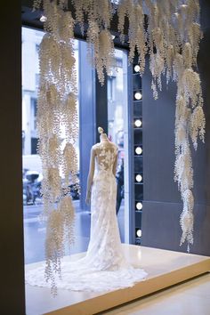 a mannequin dressed in a white wedding dress