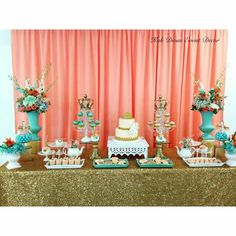 a table topped with lots of cakes and desserts