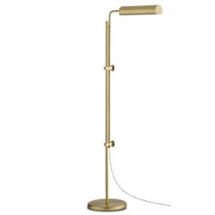 a gold floor lamp with a white background