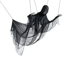 a person in a ghost costume is suspended on strings with black netting around their body