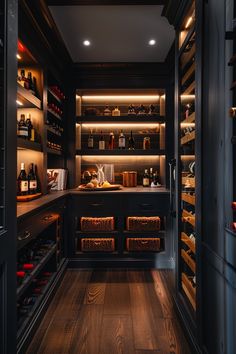 an empty wine cellar with lots of bottles in the shelves and lights on either side