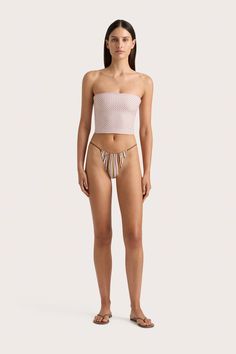 A fitted strapless swim top, cropped just above the waist. Printed in subtle floral motif, pair with the Eléa String Bikini Bottom or style as ready-to-wear with a relaxed pair of trousers. Chic Bandeau Bottoms For Poolside, Bandeau Bottoms For Poolside And Beach Season, Spring Beachwear Seamless Crop Top, Seamless Cropped Summer Bottoms, Spring Seamless Cropped Bottoms, Summer Bandeau Bottoms With Built-in Bra, Cropped Seamless Summer Bottoms, Feminine Seamless Spring Bottoms, Feminine Seamless Bottoms For Spring