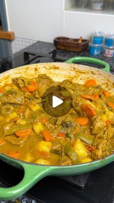 a green pan filled with food on top of a stove