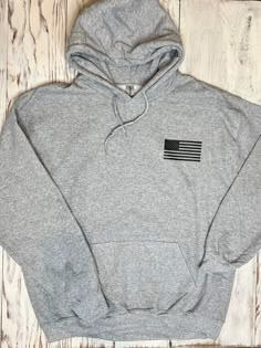 Men's Deer Hunter Heavy Hoodie Sweatshirt This is a thick heavyweight sweatshirt to wear out hunting or just any day. The hoodie features a small black flag on the front and a bow hunter graphic on the back. "No Bragging until you're Dragging" Unisex fit. Western Hoodies, Trendy Clothing Stores, Casual Country Outfits, Bow Hunter, Country Hoodie, Southern Outfits, Deer Hunter, Western Wear Outfits, Cute Country Outfits