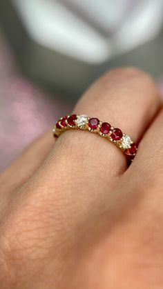 DETAILS: * Handmade item * Gemstone: Ruby, Natural Diamond * Gem color: Red * Band color: Yellow Gold (may vary on gold selection) * Condition: Never been Used; Made to order, Recycled Metal, Conflict-free 100% DESCRIPTION: 💎 Welcome to the Our Shop, Congratulations🍾 on discovering us. 💎 You'll be amazed at the beauty and delicate craftsmanship of this ring. This custom 18-karat gold stacking eternity ring features alternating 3 round rubies sitting side-by-side with one white diamond in a sh Elegant Ruby Ring, Ruby Diamond Eternity Band, Ruby And Sapphire Rings, Ruby And Diamond Eternity Ring, Diamond Ruby Ring, Diamond And Ruby Rings, Luxury Ruby Eternity Band As A Gift, Brilliant Cut Ruby Gemstones For Fine Jewelry, Brilliant Cut Ruby Gemstones Fine Jewelry