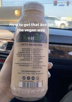 someone holding up a bottle of keto smoothie