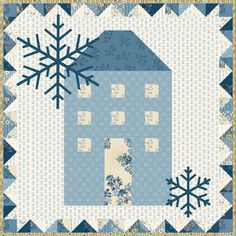 a quilted house with snowflakes on the top and bottom, in blue