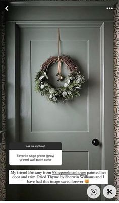 a door with a wreath hanging on it's side and an email message to someone