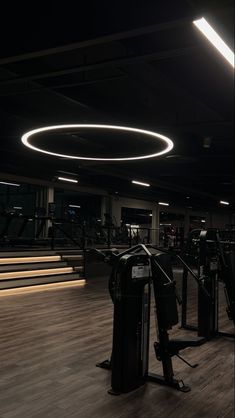 an empty gym with treadmills and exercise machines