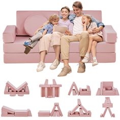 a family sitting on a pink couch with their arms around each other and looking at a tablet