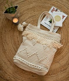 Handwoven bags made from 100% natural cotton. These are woven on handloom by the local weavers in the villages of Northern India. Minimalist beige color with lovely knots, loops and shags in beige for the bohemian look. Internal cotton lining with a zipper pocket to keep your belongings & a magnetic push button for closure. Size: 45 x 45 cm (excluding handles) Perfect for some casual shopping or lazing on the beach! We at Ornate pay due attention to sustainability and continuing the long tra Farmers Market Tote Bag, Boho Chic Bags, Boho Tote Bag, Handwoven Bag, Boho Picnic, Boho Tote, Beige Boho, Picnic Bag, Macrame Bag