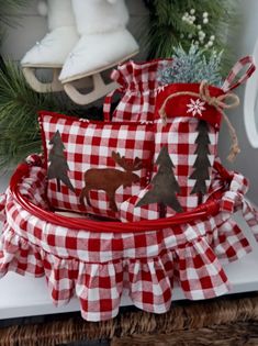 a basket filled with christmas decorations on top of a table