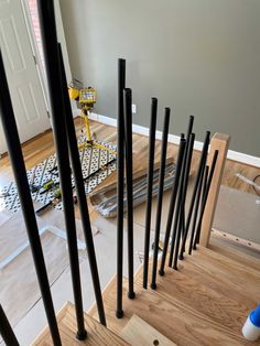 some black poles are on the floor in this room