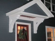 a house with a wreath on the front door