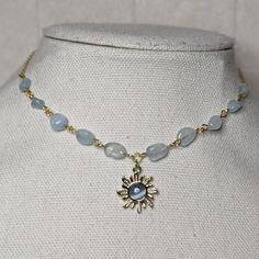 Aquamarine Blue Crystal And Gold Sun Charm Beaded Choker Necklace Measures Approximately 14 Inches With A Lobster Clasp And 1.5 Inch Extension Chain. Bead Color And Size May Vary As These Are Made To Order. Summer Blue Gemstone Beads Jewelry, Blue Beaded Necklaces With Faceted Beads For Summer, Summer Blue Beaded Necklaces With Faceted Beads, Summer Blue Necklaces With Faceted Beads, Crystal Girl, Sun Charm, Gold Sun, Beaded Choker Necklace, Aquamarine Blue