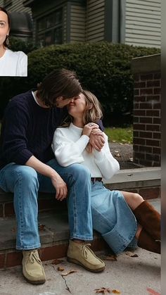 a man and woman are sitting on the steps with their heads close to each other