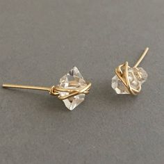 Two Herkimer diamonds are wire-wrapped with 14k Gold Fill, Rose Gold Fill, or Sterling Silver wire. Herkimer diamonds measure approximately 3/8 of an inch long. Item comes packaged in a jewelry box. YOUR ORDER - Choose either gold fill, rose gold fill, or sterling silver in the drop-down menu. - You can select expedited shipping at checkout. Please note that shipping time does NOT include production time. - Item comes packaged in a jewelry box. Gold Hand-wrapped Earrings For Gift, Delicate Wrap Earrings For Gift, Gold Hand-wrapped Wrap Earrings As Gift, Gold Hand Wrapped Wrap Earrings As Gift, Gold Hand Wrapped Wrap Earrings For Gift, Gold Hand Wrapped Earrings For Gift, Hand Wrapped Gold Earrings For Gifts, Studio City, Earrings In Gold