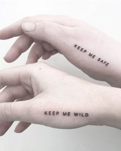 two hands holding each other with words on their fingers that read keep me safe and keep me wild