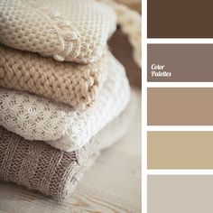 a stack of knitted sweaters on top of each other in shades of brown and beige