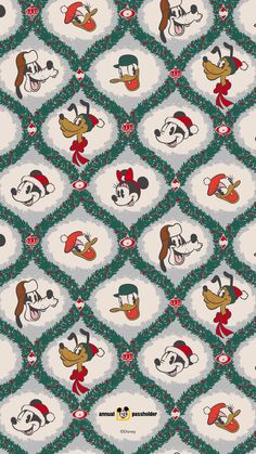 mickey mouse christmas fabric with santa hats and other cartoon characters on it's green background