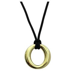 TIFFANY & Co. 18K Gold Elsa Peretti 24mm Wide Sevillana Pendant Necklace Metal: 18K yellow gold Gold weight: 3.90 grams Pendant: 24mm (0.95") wide Silk Cord: Tiffany 16" black silk cord Hallmark: TIFFANY&CO. ©Elsa Peretti 750 SPAIN Tiffany price: $2,000 Authenticity Guaranteed Elsa Peretti, Silk Cord, Tiffany And Co, Metal Necklaces, Black Silk, Tiffany & Co., Metallica, Jewelry Necklace Pendant, 18k Gold