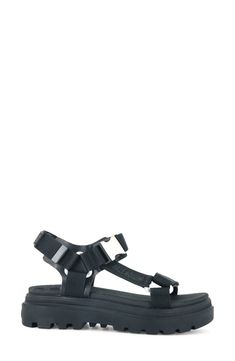 Enter the sunnier seasons in modern style with this platform sandal showcasing a sleek buckle strap and a grippy lugged sole for superior traction. 1 3/4" heel (size 7) Adjustable ankle strap with buckle and hook-and-loop closure Cushioned footbed Textile upper and lining/synthetic sole Imported Casual Black Footbed Sandals With Tang Buckle, Black Sandals With Buckle Closure For Outdoor, Black Buckle Closure Sandals For Outdoor, Adjustable Black Sandals With Tang Buckle, Modern Black Footbed Sandals With Ankle Strap, Adjustable Black Sandals With Buckle, Modern Black Ankle Strap Footbed Sandals, Casual Strapped Sandals With Buckle Closure, Black Strap Sandals For Outdoor