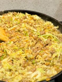 a skillet filled with cabbage and meat