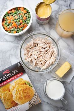 ingredients for chicken pot pie laid out on a marble table