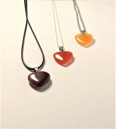 Genuine Carnelian heart shaped necklace Second image is to show the different shades of the carnelian hearts- if you have a preference please do let me know! Heart-shaped Natural Stones Necklaces For Jewelry Making, Heart-shaped Brown Necklace For Gift, Brown Heart-shaped Necklace For Gift, Heart-shaped Healing Necklaces With Natural Stones, Heart-shaped Orange Necklace For Gift, Brown Necklace With Heart Charm For Gift, Orange Heart Charm Jewelry, Brown Heart Charm Necklace As A Gift, Brown Heart Charm Necklace As Gift