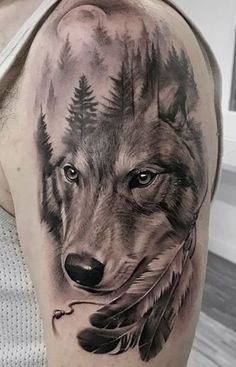 a man with a wolf tattoo on his arm