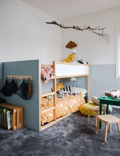 a child's bedroom with bunk beds and toys