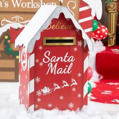 a red mailbox with santa claus on it