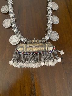 "Here is an amazing, original necklace from Oman. It measures approximately 37 3/4\" (95,8 cm) long. The main pendant measures 4 5/8\" (11,75 cm) long and ~ 5 3/4\" (14,6 cm) wide. This is wonderful vintage piece, in great shape commensurate with age and tribal use. It features gorgeous workmanship. It is strung on its original cotton cording. The darker material on the loop side is from incense, often applied to jewelry from this region. This piece is truly massive and weighs in at just over 71 Original Necklace, Arabian Peninsula, Indian Jewelry Earrings, Western Asia, Dark Material, Ethnic Necklaces, Jan 17, Tucson Az, The Loop