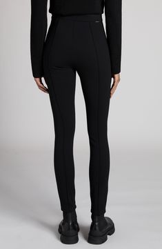 Striking a balance between athleisure and streetwear, these leggings made of a stretch-enhanced twill knit and finished with stitched pintucks deliver all-around, versatile style. Hidden side-zip closure 95% polyamide, 5% elastane Hand wash, dry flat Imported Designer Clothing Chic High Stretch Elastane Leggings, Modern Stretch Activewear With Elastane, Modern Stretch Elastane Activewear, Modern Stretch Activewear, Fitted Bottoms With Elastic Side Panels For Fall, Stretch Elastane Activewear With Tapered Leg, Tapered Leg Elastane Activewear, Tapered Leg Stretch Activewear, Stretch Tapered Leg Elastane Leggings