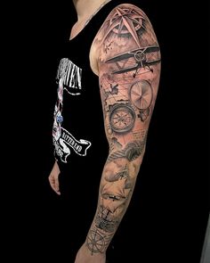 a man's arm with an airplane and compass tattoo on the left side of his arm