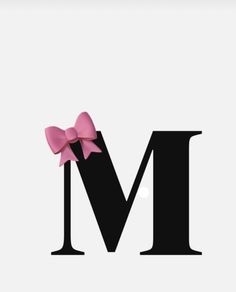 the letter m has a pink bow on it