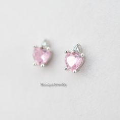 The pink color is vibrant and sweeps across the stone. The stone is a brilliant-cut style of tourmaline showing off the depths of pink that is completely mesmerizing and a tiny CZ on top of the heart-shaped Pink Simulated Tourmaline. 🎀 Material: 0.925 Sterling Silver 🎀 Finishing: High Polish, Rhodium plated (Anti-Tarnish) 🎀 Width: 5 mm 🎀Height: 6 mm 🎀 Shape: Heart 🎀 Closure: Push Back 🎀 Sold as a PAIR ✈️READY TO SHIP the next day! 🎀 Please note that pictures are magnified to show the det Pink Heart-shaped Gemstone Jewelry, Pink Heart Cut Gemstone Jewelry, Pink Dainty Sterling Silver Earrings, Dainty Pink Sterling Silver Earrings, Pink Fine Jewelry Heart Earrings As Gift, Pink Double Heart Jewelry With Matching Earrings, Pink Heart Earrings Fine Jewelry For Gifts, Pink Pierced Heart Earrings For Anniversary, Pink Round Earrings For Valentine's Day