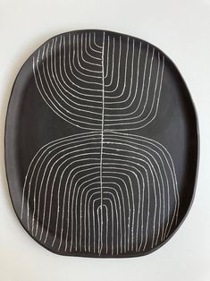 a black plate with white lines on it