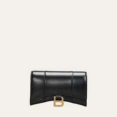 Balenciaga hourglass-shaped crossbody bag in sleek calf leather. Detachable chain shoulder strap; 20" drop Flap top with metal B hardware; snap closure. Exterior, slip compartment at back. Interior, zip and slip pockets. Nappa lambskin lining. 4.7"H x 7.6"W x 1.9"D Wipe with a soft cloth. Made in Italy. Leather Wallet On Chain With Metal Logo For Evening, Classic Evening Wallet On Chain With Metal Logo, Classic Leather Wallet On Chain With Metal Logo, Chic Wallet On Chain With Metal Logo For Everyday, Chic Evening Wallet On Chain With Metal Logo, Chic Evening Wallet On Chain With Branded Hardware, Designer Leather Wallet On Chain With Palladium Hardware, Luxury Business Wallet On Chain With Chain Strap, Chic Leather Wallet On Chain With Branded Hardware