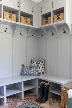 a white bench with some baskets on it