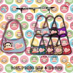 three purses with monkey faces on them and the words love in pink, blue, yellow