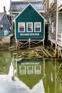 a house on stilts is surrounded by water