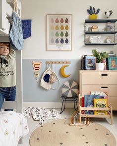 a child's bedroom with blue and white striped walls