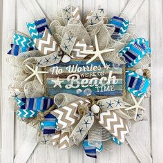 a wreath made out of burlocks and ribbons with the words no worriess we're on beach time