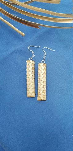 Lauhala earrings, handwoven here on Maui. We collect the leaves of the pandanas tree, clean and prepare them for weaving, all by hand Each item woven is unique and one of a kind, due to the natural color of the leaves. These earrings are about 2 1/2 inches long and are on sterling silver earwires.  The earrings in the photo have been sold, but you will receive a similar pair.  Colors will vary depending on the leaves we have. Earrings will come to you wrapped in tissue in an organza bag, or in a gift box if your prefer. Just let us know is you would like a box . We ship in a box by priority mail Handmade Traditional Rectangular Earrings, Traditional Handmade Rectangular Earrings, Natural Dangle Earrings, Nature-inspired, Nature-inspired Dangle Earrings In Natural Color, Traditional Natural Jewelry For Gifts, Traditional Natural Jewelry As A Gift, Traditional Handwoven Jewelry, Elegant Handwoven Natural Jewelry, Traditional Handwoven Rectangular Jewelry