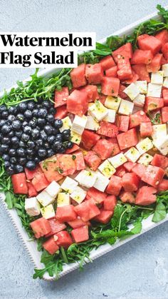 watermelon salad with feta cheese and blueberries on a white platter