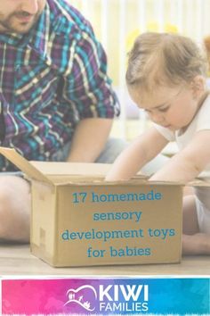 a father and his child playing with toys on the floor in front of a cardboard box