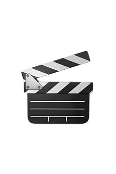 a black and white movie clapper with a pair of scissors on it's side