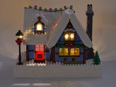 a lit up house made out of legos