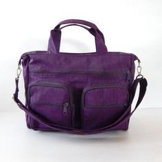 *** Please check 'shop announcement' for production time and delivery before your purchase. ***This all purpose bag is made from deep plum water resistant nylon, a sturdy and durable material. It is big enough to hold lots of your everyday essentials, laptop and books. You can use it as a messenger bag and also a diaper bag, a travel bag or a school bag. You can order this bag slightly BIGGER or SMALLER, please just let me know.The detachable strap is adjustable from 27" to 47" which you can wea Multifunctional Purple School Bag, Multifunctional Bag With Adjustable Strap For Trips, Purple Multifunctional Bag For Daily Use, Purple Travel Shoulder Bag With Zipper, Multifunctional Purple Bag For Daily Use, Purple Shoulder Bag With Zipper For Travel, Functional Purple Bag With Adjustable Strap, Rectangular Weekender Bag With Adjustable Strap For School, Purple Duffle Bag For Daily Use